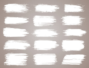Paint brush. White ink grunge brush strokes. paintbrush set. Grunge design elements. Painted ink stripes. Creative isolated spots. Ink smudge abstract shape stains and smear set