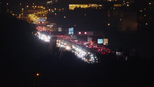 time lapse of dense traffic on highway at night