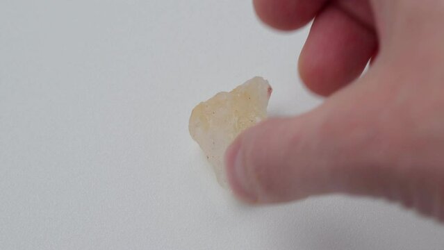 Crystal of Citrine yellow quartz mineral gem stone. White background