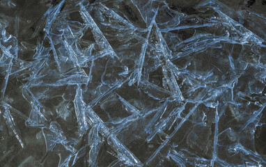 Fototapeta premium Blue ice with detailed structure close-up. Natural background