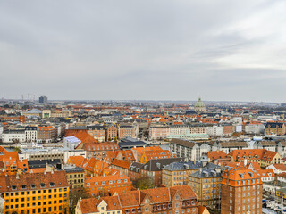 Fototapeta na wymiar Copenhagen's colorful buildings during a cloudy day, Denmark