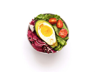 Baked egg with avocado. Bowl from healthy and balanced products. Fodmap diet concept.