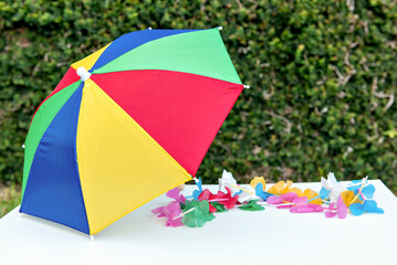 colorful carnival umbrella and necklace