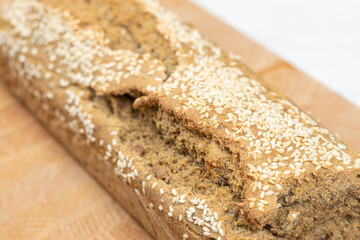 Homemade delicious integral flour bread sliced on the wooden board