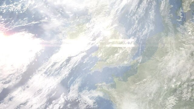 Earth zoom in from outer space to city. Zooming on Carmarthen, United Kingdom. The animation continues by zoom out through clouds and atmosphere into space. Images from NASA