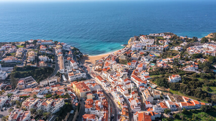 Aerial view of portuguese tourist village Carvoeiro Portugal Algarve in summer on a sunny day. streets and traditional houses  - obrazy, fototapety, plakaty