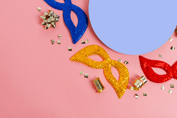 Multicolored carnival mask on blue background. Purim.
