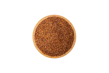 Rooibos tea medium cut in wooden bowl isolated on white background. Rooibos in latin Aspalathus linearis. herb. herbal tea. food ingredient.