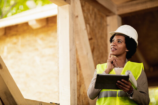 Black Woman Architect Using A Digital Tablet At Construction Site