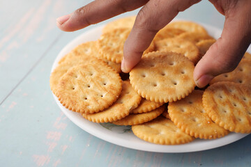  top view of hand pick sweet cookies on wooden table 