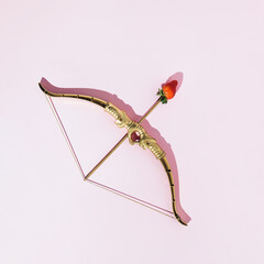 Fototapeta premium Creative aesthetic archery concept, fresh strawberry on top of arrow, pastel pink background. 