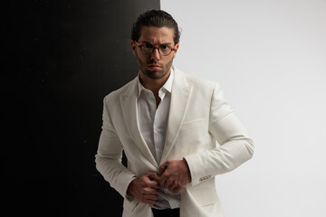 businessman aggressively opening his jacket