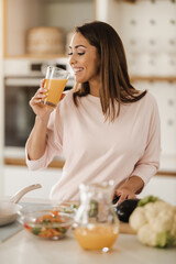 Woman Drinking Fresh Orange Juice