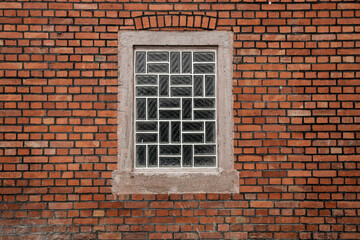 Red brick wall with  glass brick window, space for background