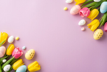 Fototapeta na wymiar Easter concept. Top view photo of spring flowers bunches of yellow and pink tulips and colorful easter eggs on isolated pastel violet background with empty space