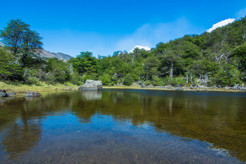 Fototapeta na wymiar View of a beautiful lake at the trail to Cerro Torre (Torre Mountain) - El Chaltén, Argentina