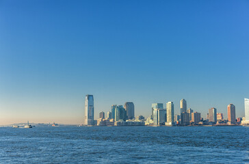 Fototapeta na wymiar Cityscape with Jersey City. Early Morning Sunlight. New Jersey, USA.
