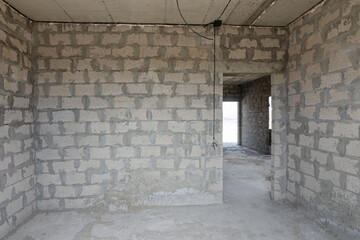 Construction of an individual residential building, room wall view with a doorway