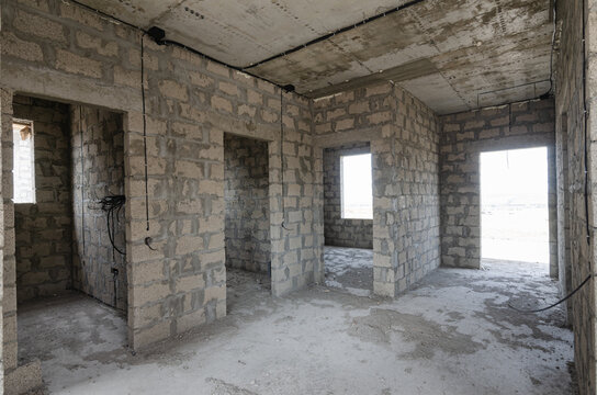 Construction of an individual residential building, view of the front door and doorways to bathrooms and rooms © madhourse