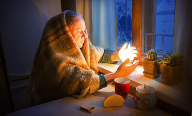 Woman with candles. Power outage in Kyiv