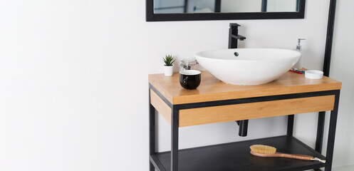 Minimalist bathroom with sink wooden table