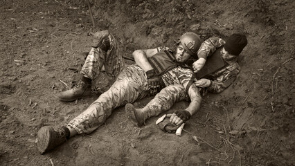 Medical help to wounded soldier