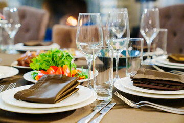 a festive served table with snacks and tableware.
