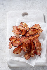 Crispy Cooked bacon rashers on parchment