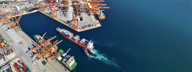 Aerial drone ultra wide top down panoramic photo with copy space of container tanker anchored in...