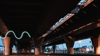 Night highway under the bridge on long exposure
