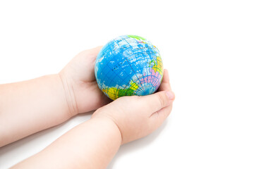 Hands of the child hold the globe isolated on white background. The concept of environmental protection, ecology and life saving.