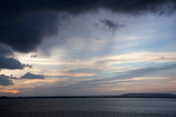 Fototapeta na wymiar Tampa Industrial Shore With Rainy Clouds At Dawn