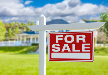 For Sale Real Estate Sign in Front of New House.