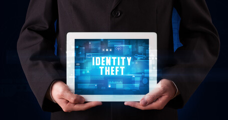 Person holding tablet, security concept