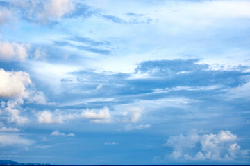 Beautiful clouds sunset light on blue sky with pink hues in asia on Bali island