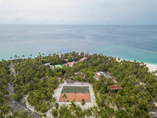 Aerial view from the drone of a tourist village in the Maldives.