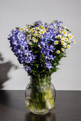 Beautiful bouquet in a vase illuminated by a flash