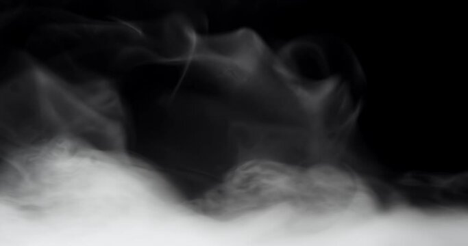 Rolling smoke clouds or swirling fog with wisps of vapor on black.