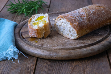 Italian ciabatta bread with olive oil, selective focus