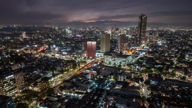 Beautiful aerial hyperlapse footage of the capital of Mexico city at night.