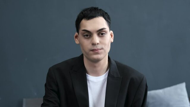 portrait of a young male tatar who eats candy