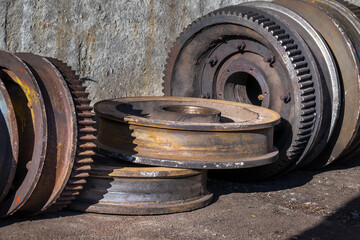 old rusty used metal wheels for rails from lifting equipment