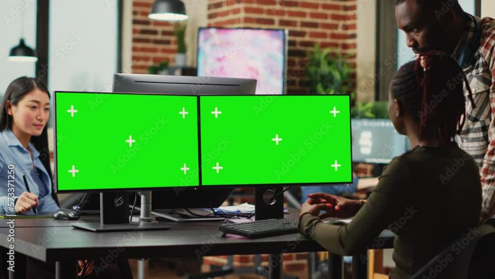 Poster digital company employees using greenscreen display on computers, checking quality of isolated mocku