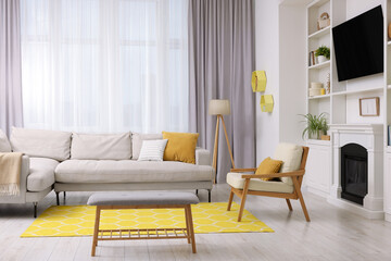 Spring atmosphere. Stylish room interior with cozy furniture in yellow and white colors