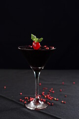 gin and tonic alcoholic iced drink vodka soda berries negrone juice with cinnamon isolated on black background