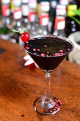 gin and tonic alcoholic iced drink vodka soda berries negrone juice with cinnamon isolated on black background