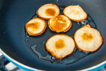 Fresh homemade pancakes flapjacks cooking on the hot pan