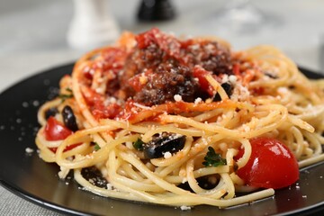 Delicious pasta with meatballs and tomato sauce served on table, closeup
