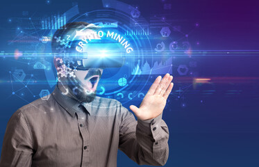 Businessman looking through VR glasses