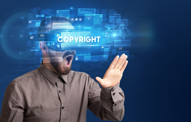 Businessman looking through Virtual Reality glasses